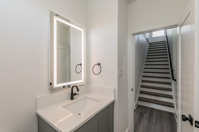 bathroom with vanity and wood-type flooring