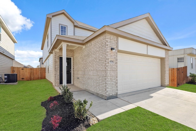 view of front of home featuring a garage, a front yard, and central AC unit