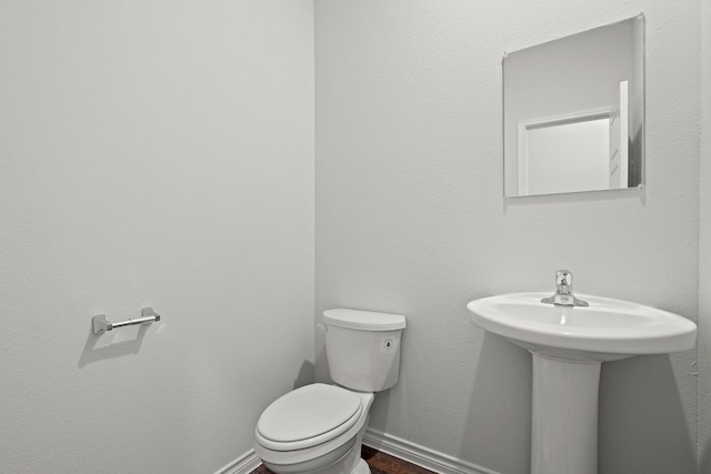 bathroom featuring toilet