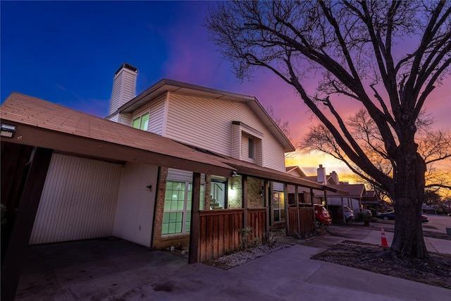 view of back house at dusk