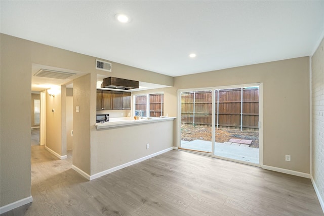 unfurnished living room featuring light hardwood / wood-style floors