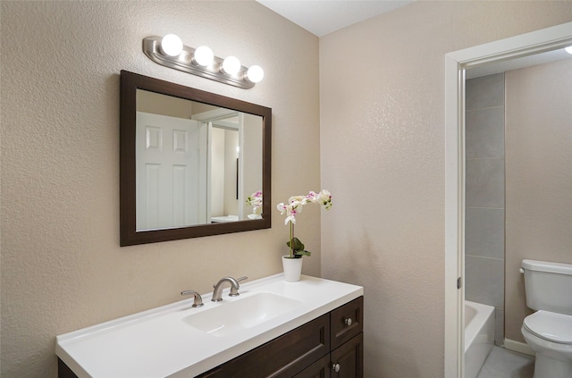 full bathroom featuring vanity, toilet, and shower / bath combination