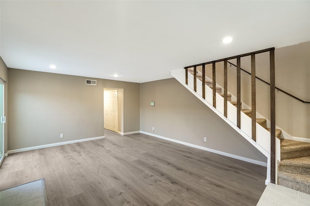 2658 Via Valencia, Carrollton, TX 75006 - unfurnished living room featuring stairs, recessed lighting, wood finished floors, and baseboards