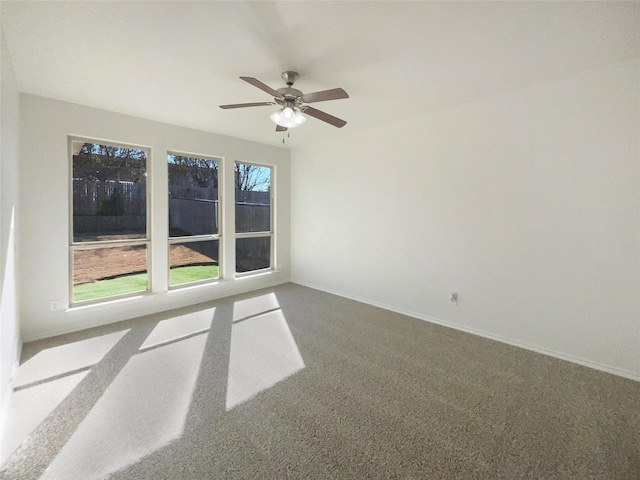 empty room featuring carpet and ceiling fan