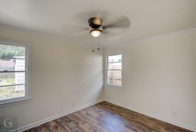 spare room with crown molding, ceiling fan, and dark hardwood / wood-style floors