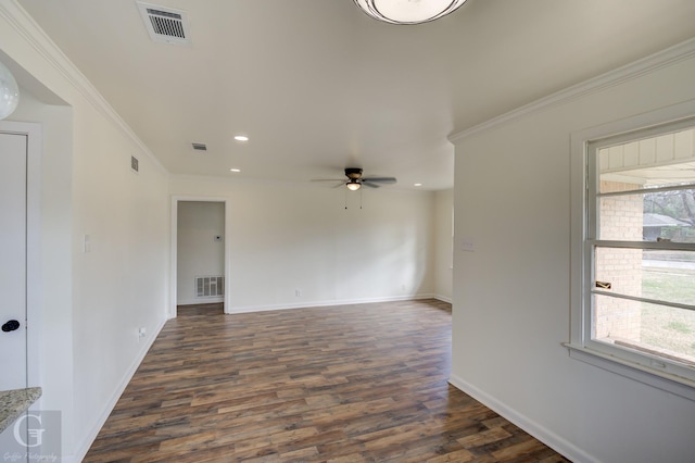 spare room with crown molding, ceiling fan, and dark hardwood / wood-style flooring