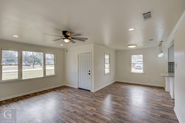 foyer entrance featuring crown molding, ceiling fan, and dark hardwood / wood-style flooring