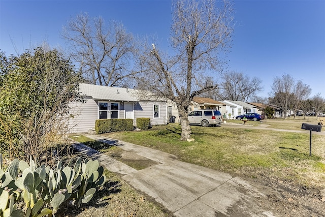 view of front of property with a front lawn