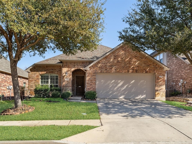 view of front facade with a front lawn and a garage