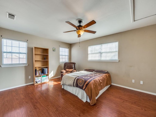 bedroom with hardwood / wood-style flooring and ceiling fan