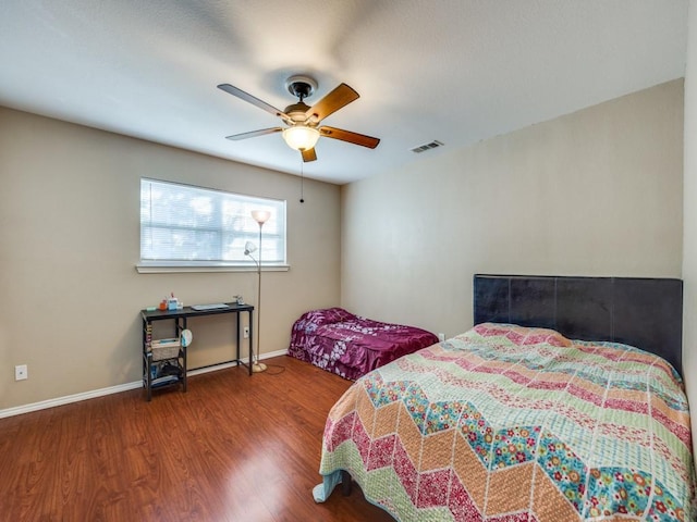 bedroom featuring hardwood / wood-style floors and ceiling fan