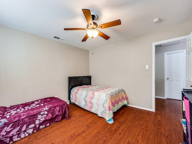 bedroom featuring dark wood-type flooring and ceiling fan