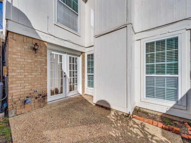 view of exterior entry featuring french doors