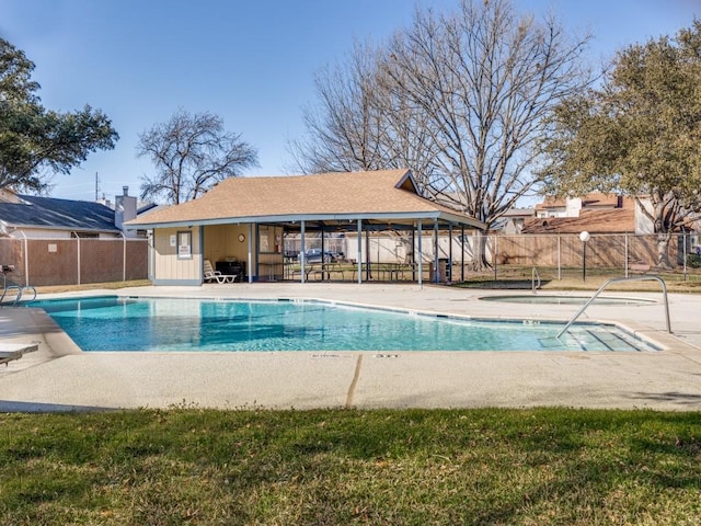 view of swimming pool with a patio