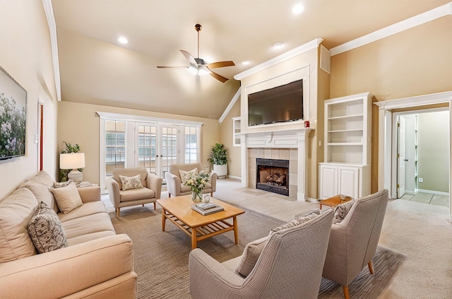 carpeted living room with ornamental molding, a fireplace, high vaulted ceiling, and ceiling fan