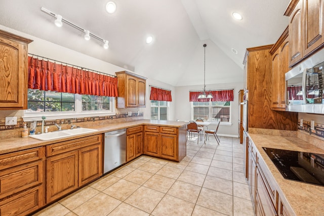 kitchen with sink, light tile patterned floors, hanging light fixtures, stainless steel appliances, and kitchen peninsula