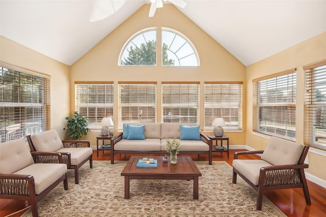 sunroom / solarium with vaulted ceiling and a healthy amount of sunlight