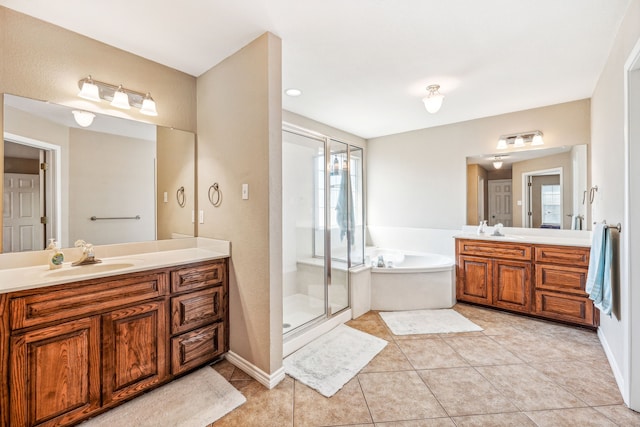 bathroom with independent shower and bath, vanity, and tile patterned flooring