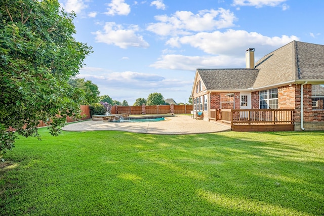 view of yard featuring a swimming pool side deck and a patio