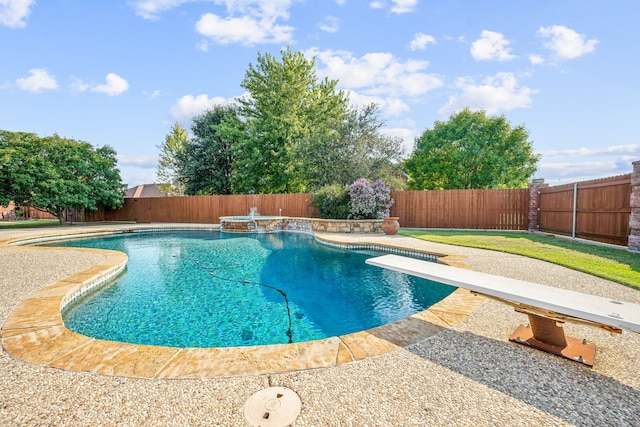 view of pool featuring a diving board