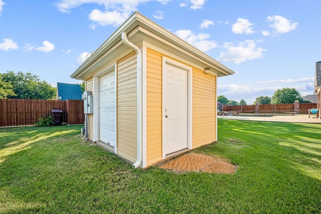 view of outbuilding featuring a yard