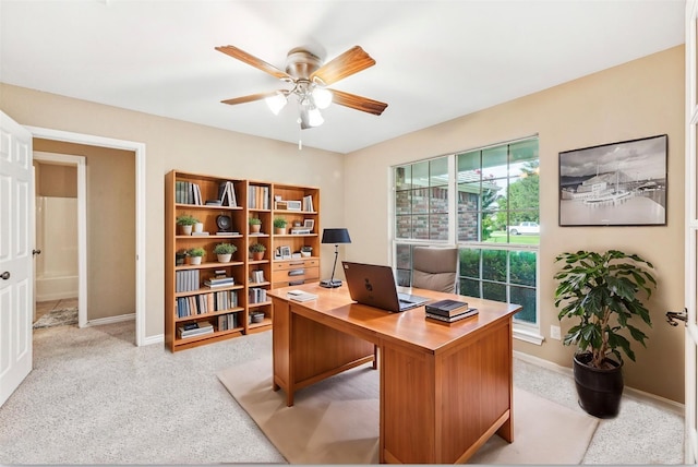 carpeted office with ceiling fan