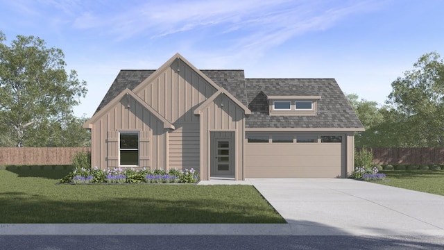 view of front of property featuring a garage and a front lawn