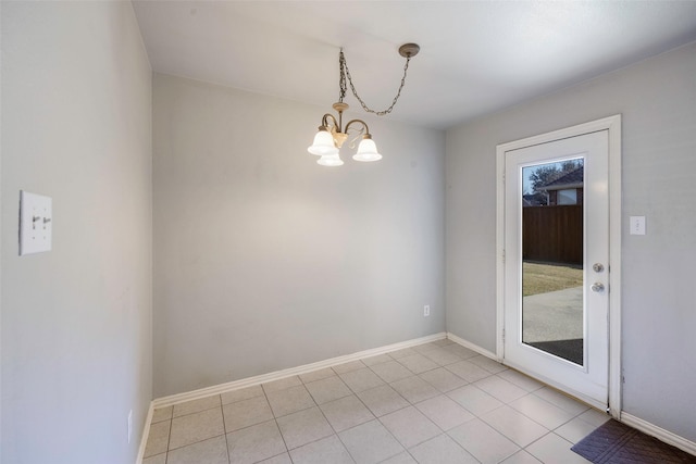 interior space featuring light tile patterned floors and an inviting chandelier