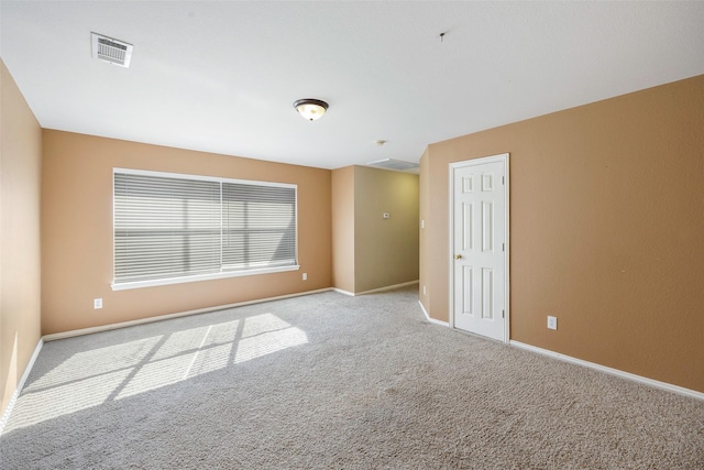 unfurnished room with light carpet