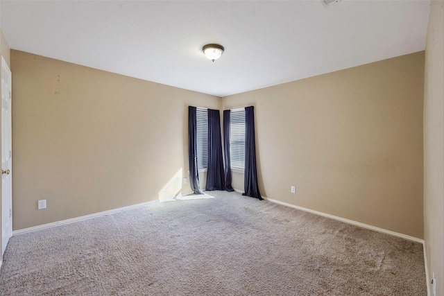 empty room with carpet flooring