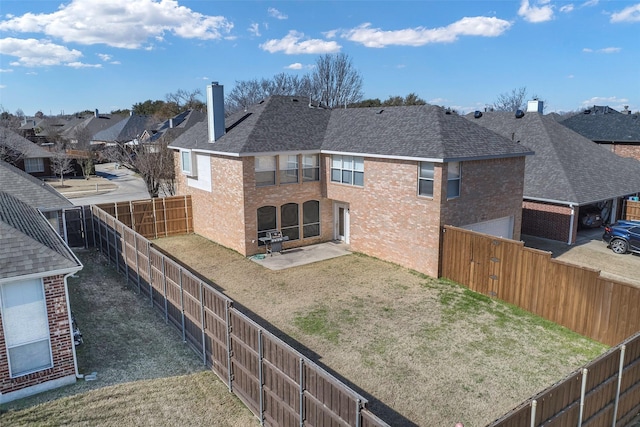 rear view of house with a patio