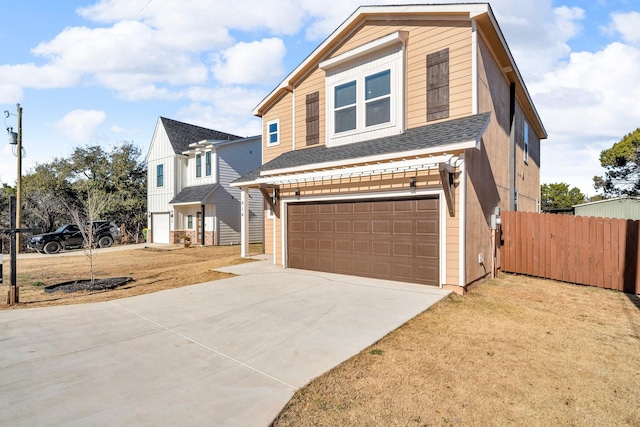 view of front of house with a garage and a front lawn