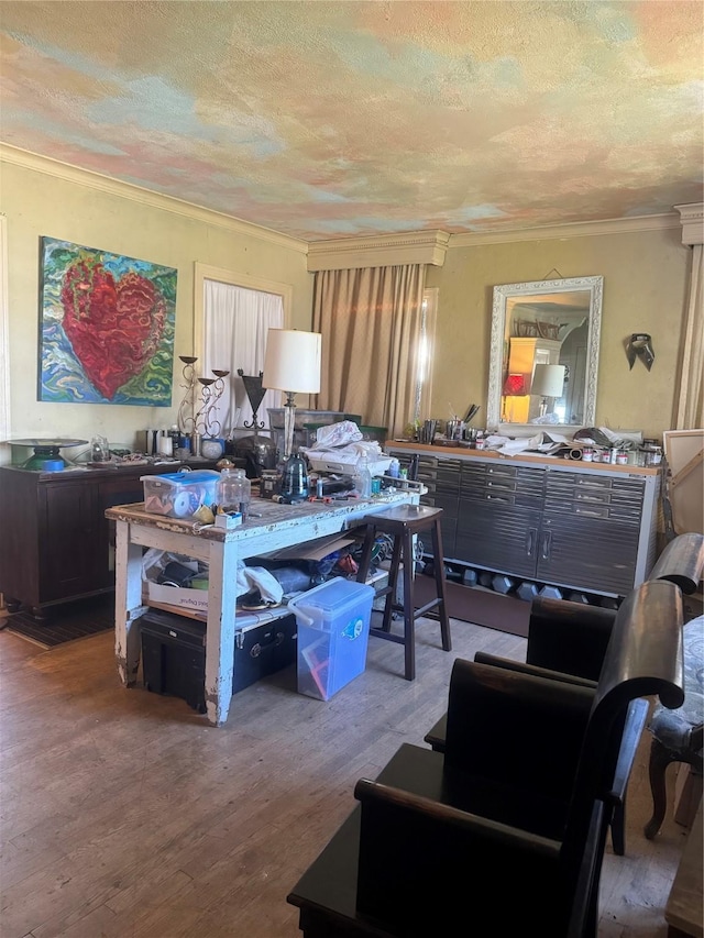 misc room featuring ornamental molding, hardwood / wood-style floors, and a textured ceiling