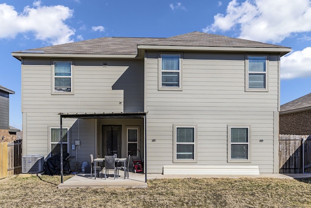 back of property featuring a patio, a yard, and central air condition unit