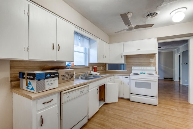 kitchen with white cabinetry, sink, light wood-type flooring, backsplash, and white appliances