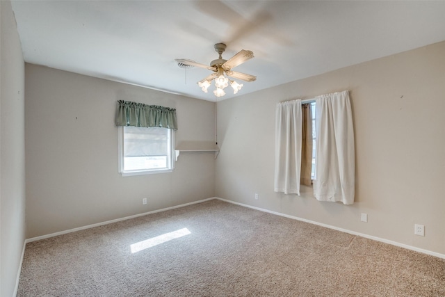 empty room featuring carpet flooring and ceiling fan