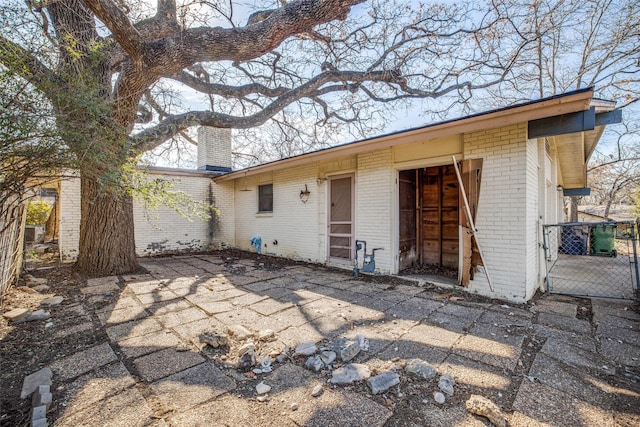 rear view of property featuring a patio area