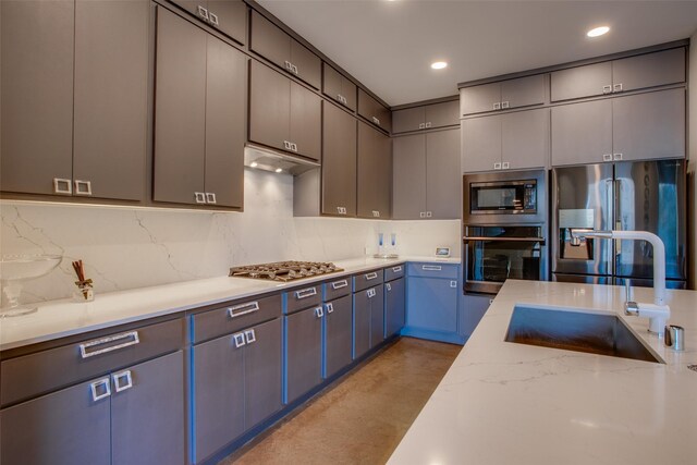 kitchen featuring sink, decorative light fixtures, a healthy amount of sunlight, and a center island with sink