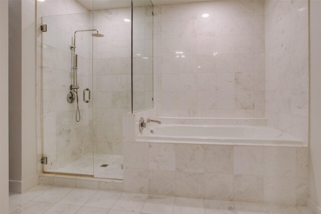 bathroom featuring walk in shower, tile patterned floors, and vanity