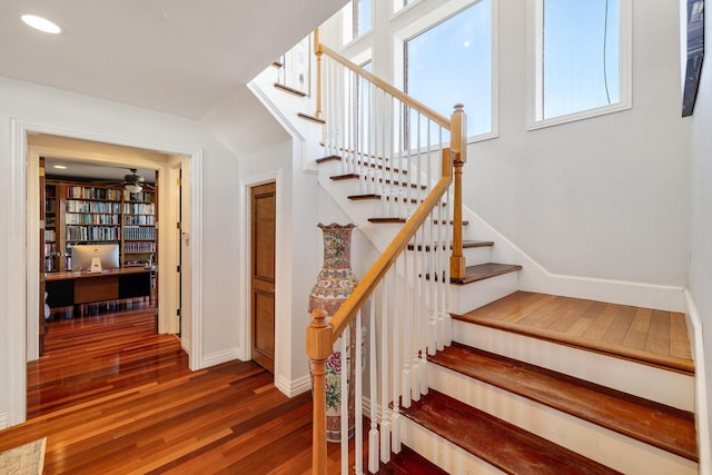 stairs with hardwood / wood-style floors