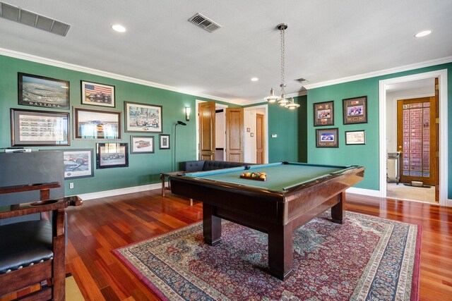 game room featuring billiards, ornamental molding, and hardwood / wood-style floors