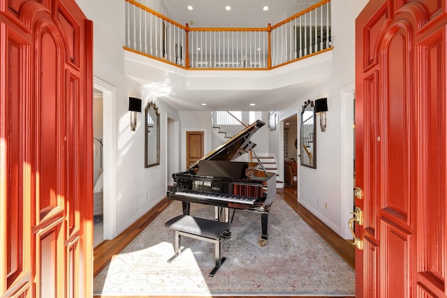 foyer with a high ceiling and light wood-type flooring