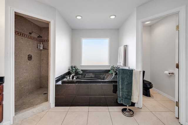 bathroom with tile patterned flooring, separate shower and tub, and toilet