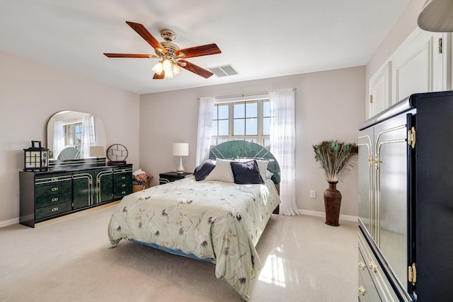 bedroom with light colored carpet and ceiling fan