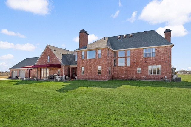 back of property featuring cooling unit and a lawn