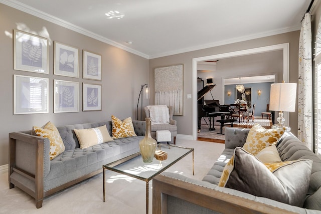 carpeted living room with crown molding and an inviting chandelier