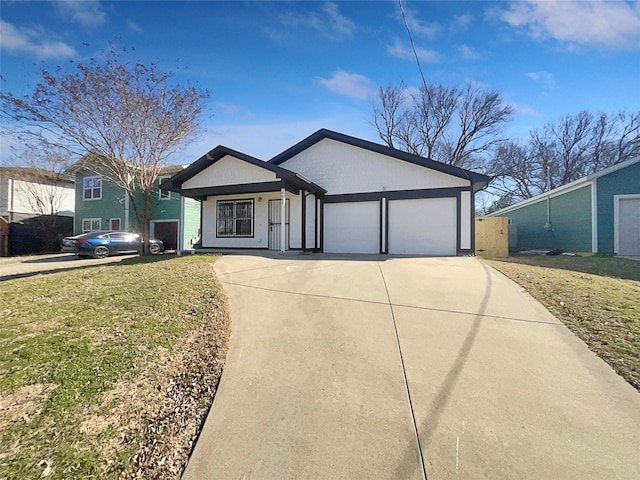 ranch-style home featuring a garage and a front yard