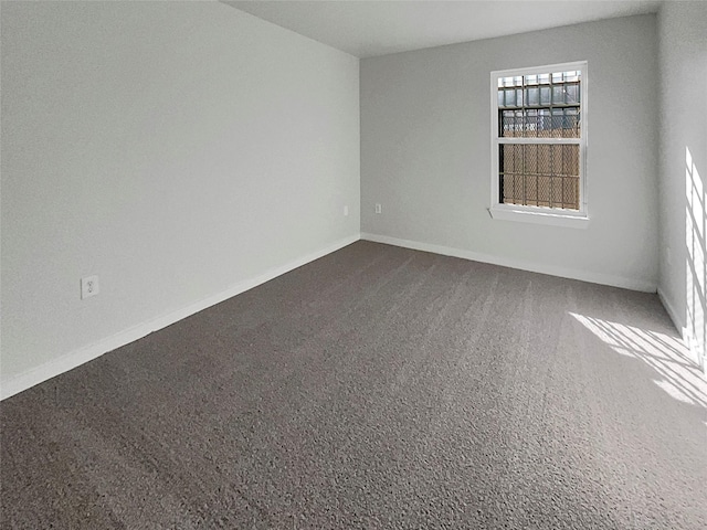 unfurnished room with carpet floors