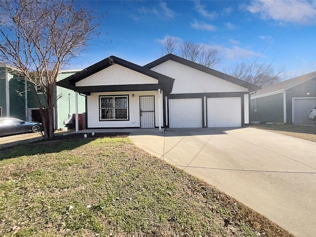 single story home featuring a garage, a front yard, and covered porch