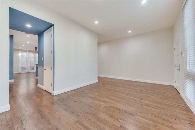 unfurnished room with light hardwood / wood-style floors